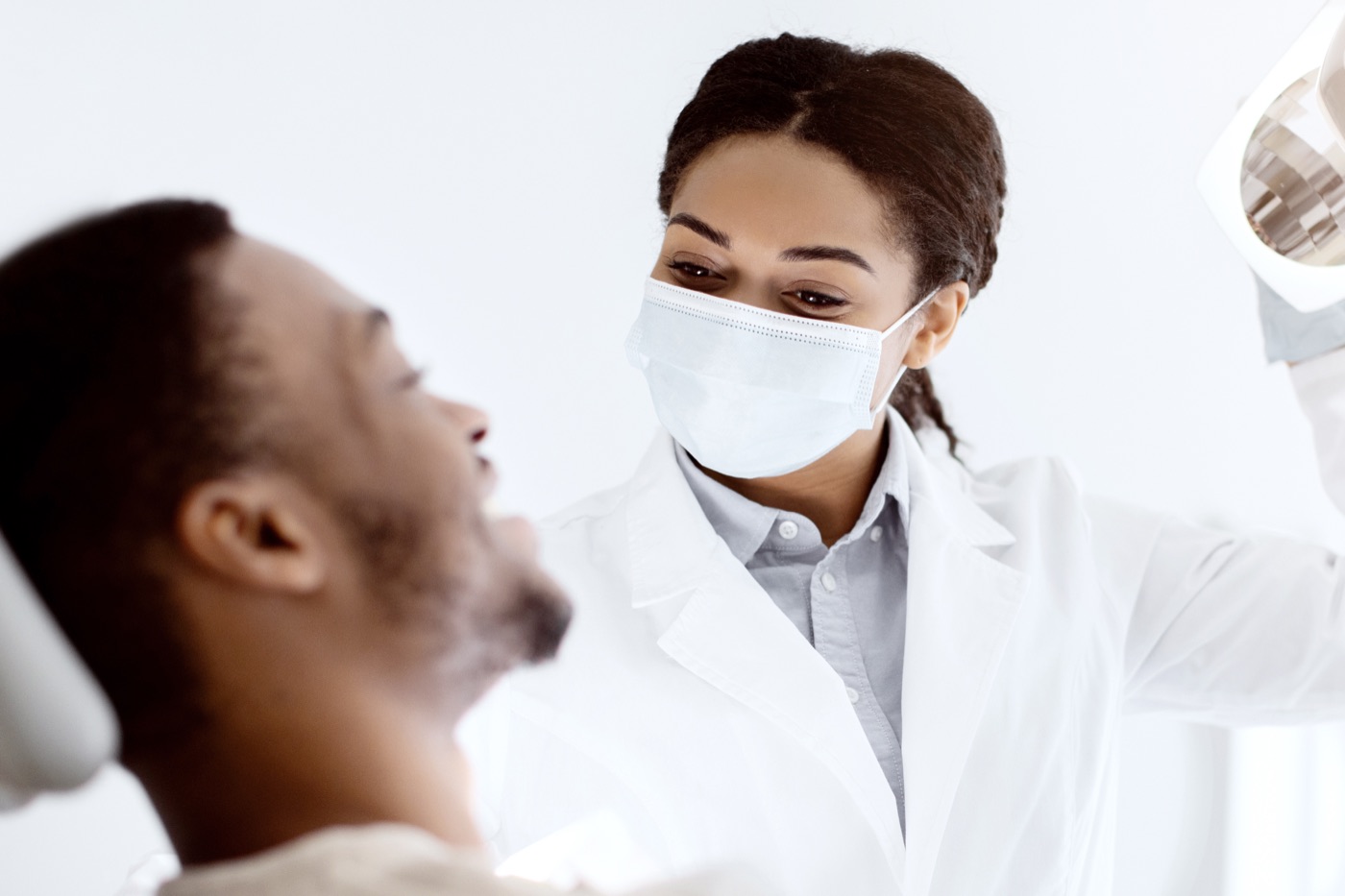 Glendale dentist examining a patient during a dental care consultation